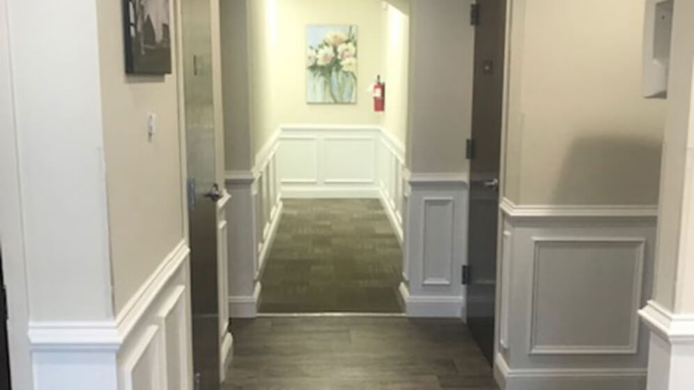 Hallway to dental office reception area